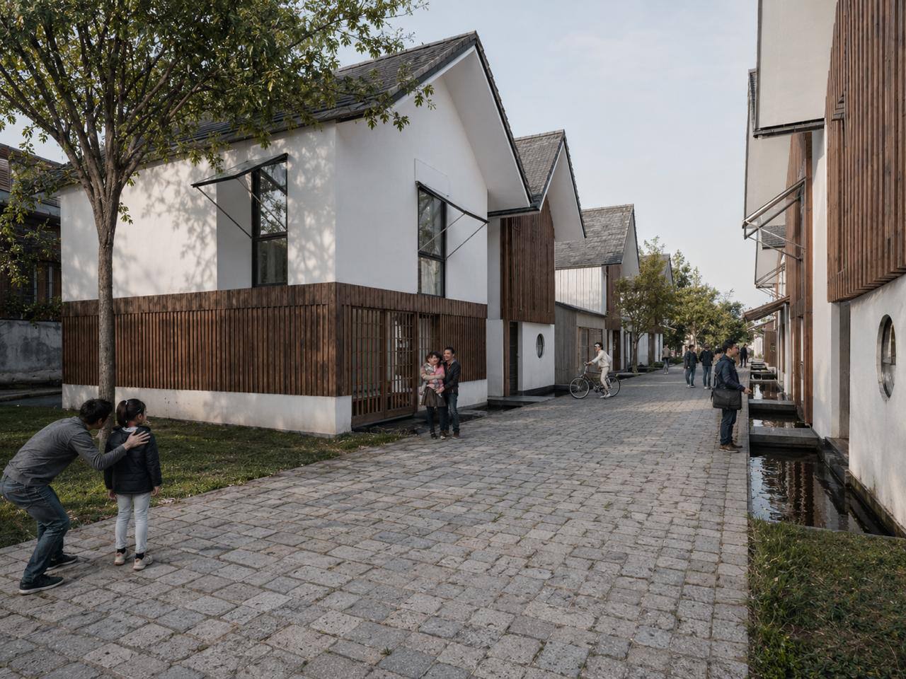 Daytime lane of pitched-roof timber residences.